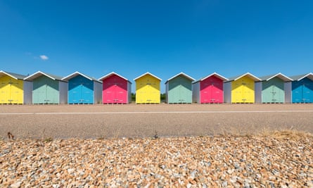 A Row of Multi-Coloured Beach Huts along the Promenade in Eastbourne