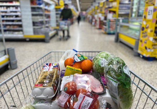 A supermarket trolley full of food