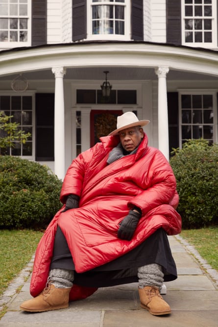 The late US Vogue editor Andre Leon Talley in a  2021 campaign for Ugg, wearing Ugg boots and big red padded coat