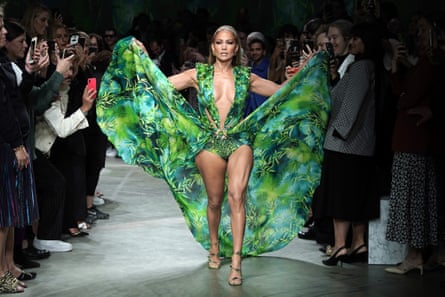 Jennifer Lopez walks the runway, in green jungle print dress, at the Versace show during the Milan Fashion Week Spring/Summer 2020 on September 20 2019 in Milan, Italy