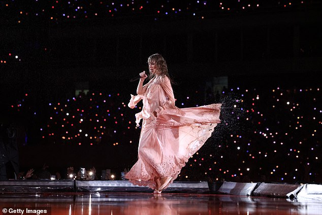 Rain or shine: Swift performed through the rain for her 65,000 fans